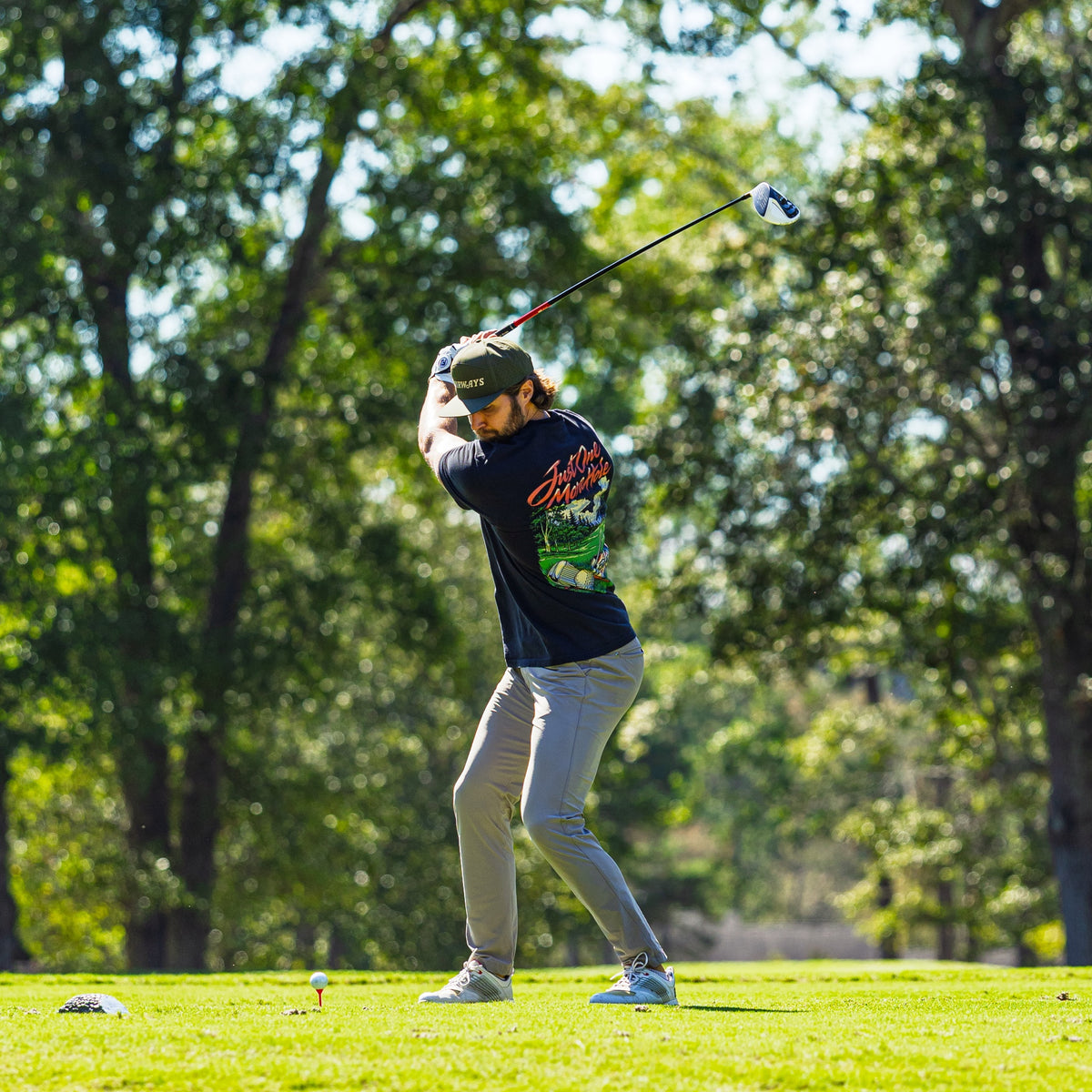 Just One More Hole Tee worn during a golf swing